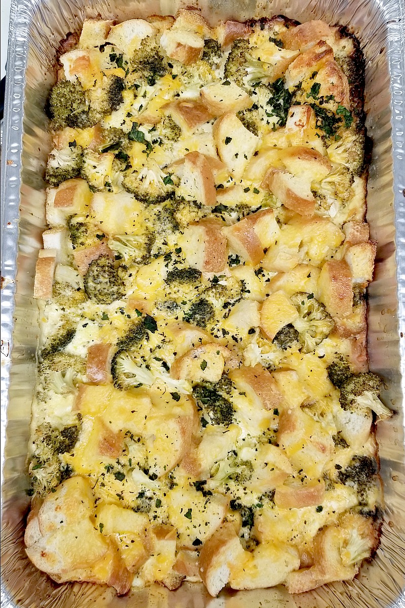 Cheesy broccoli casserole for a crowd, view in the pan of the completed recipe