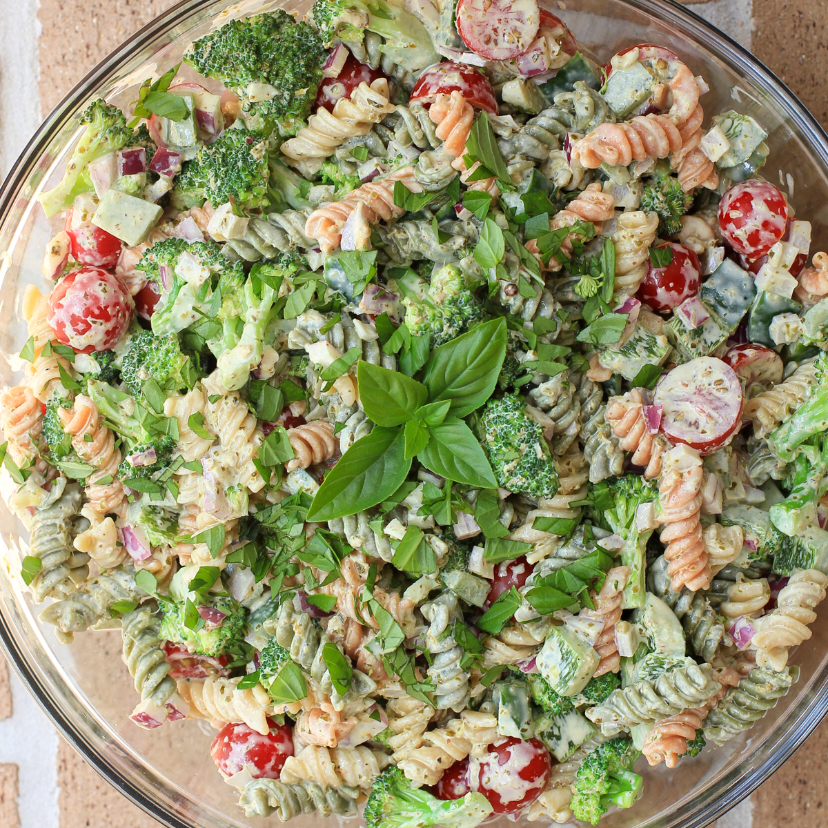 prepared pesto pasta salad recipe in glass bowl
