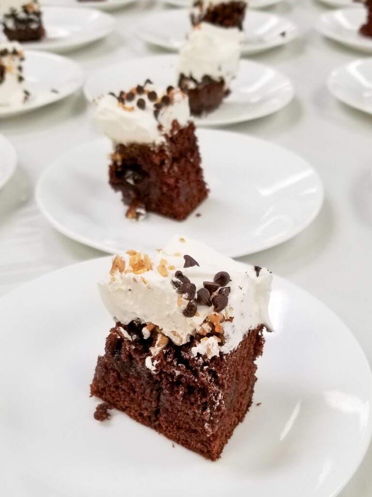 servings of chocolate cake on white plates