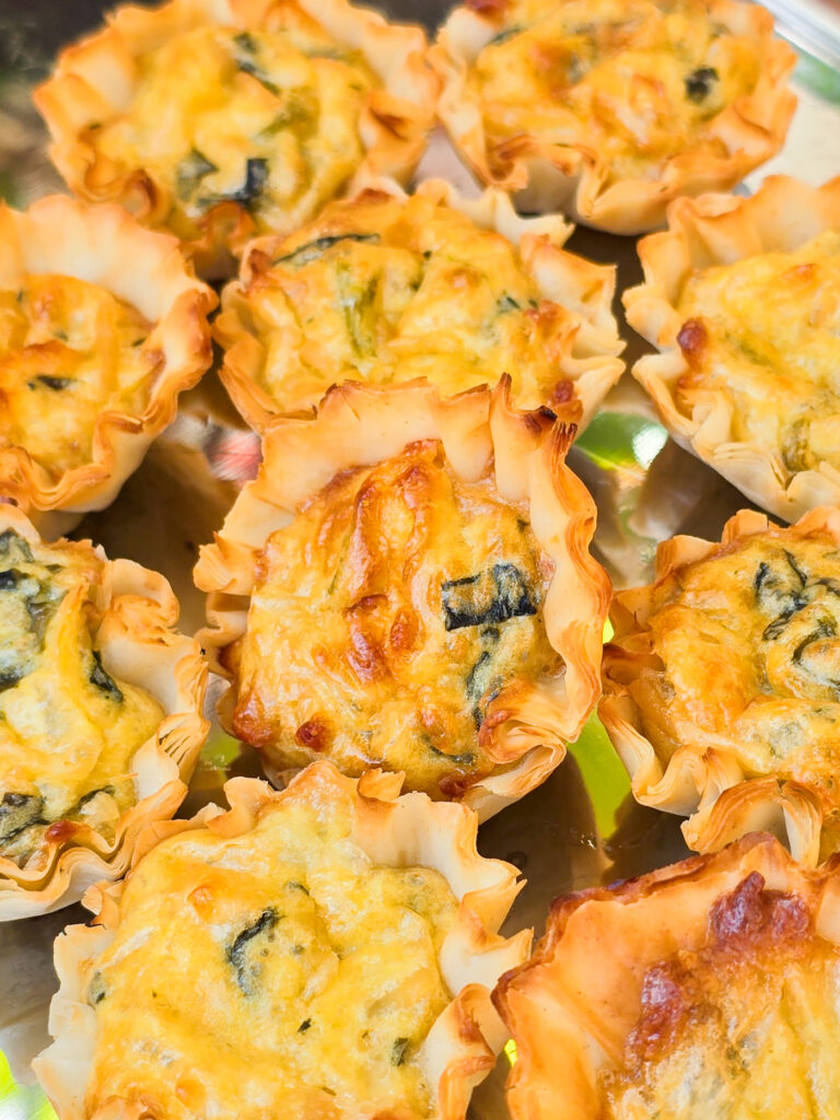 prepared mini quiches on bake sheet