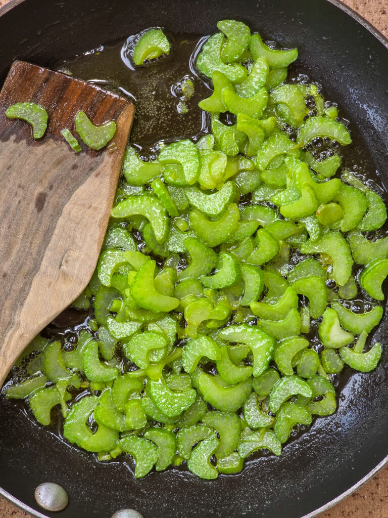 celery cooking in skillet in butter