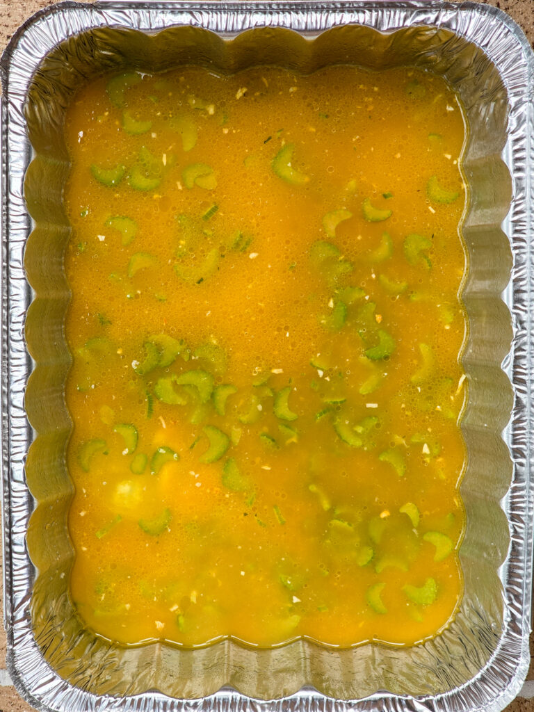 stuffing ingredients in hotel pan before adding the stuffing cubes