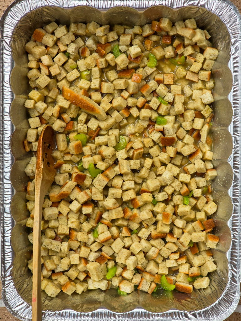 stuffing ingredients combined in hotel pan prior to cooking