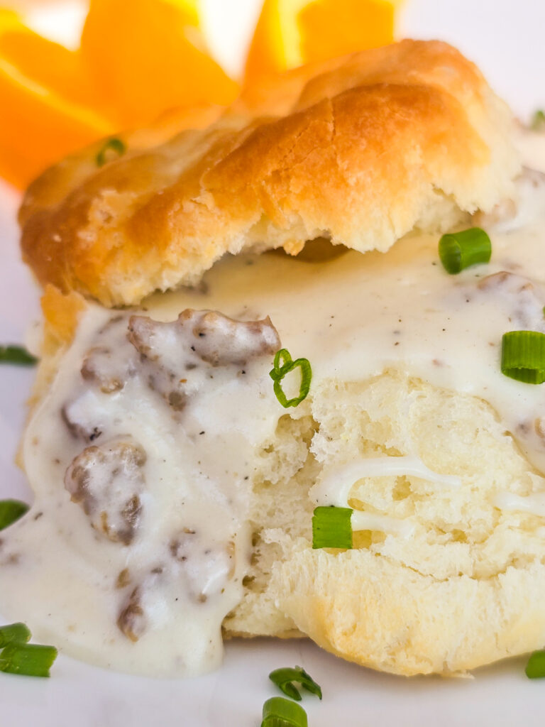 close view of sausage gravy on biscuit