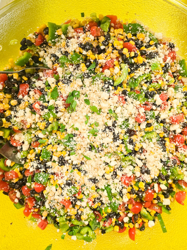 close top down view into large bowl with prepared black bean and corn salad